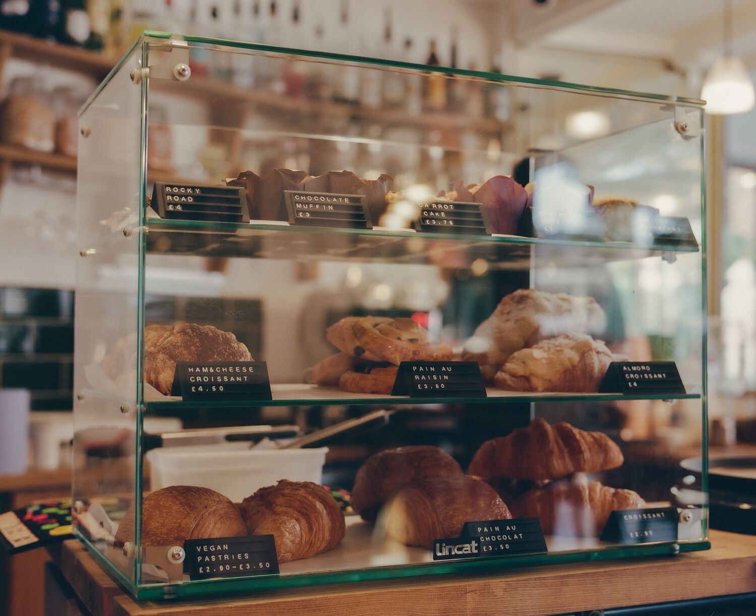 Croissants, cakes and muffins in the pastry display at Odey's